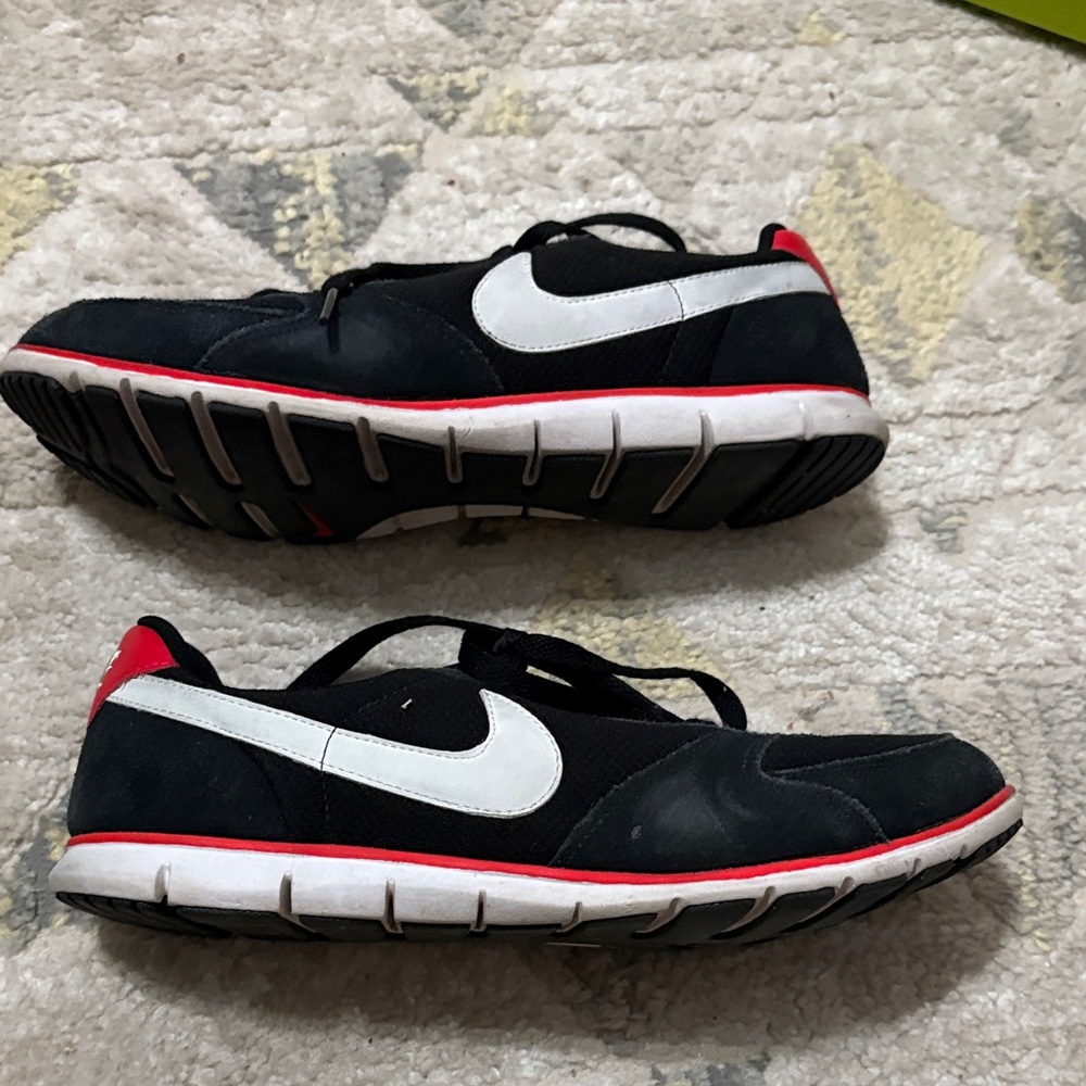 Nike Black and White Athletic Shoes with Red Accents